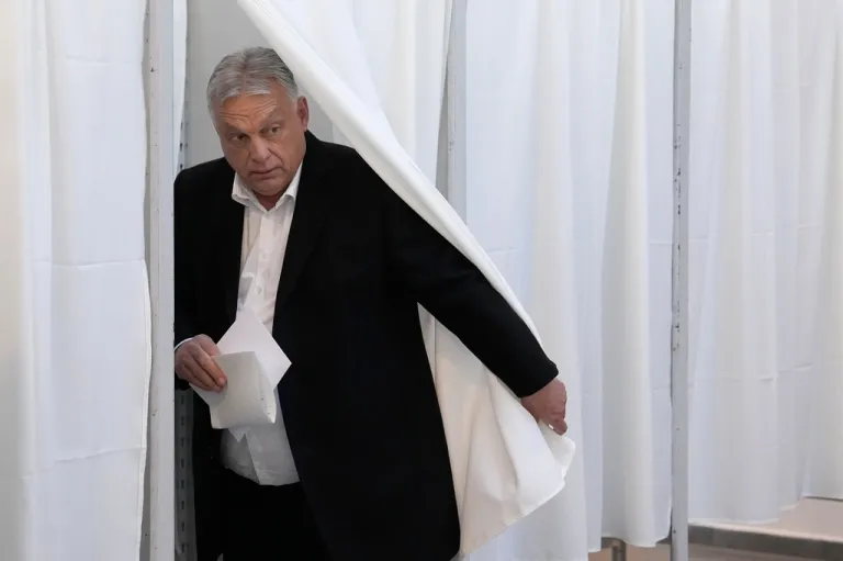 Hungarian Prime Minister Viktor Orban prepares to cast his ballot at a polling station in Budapest.