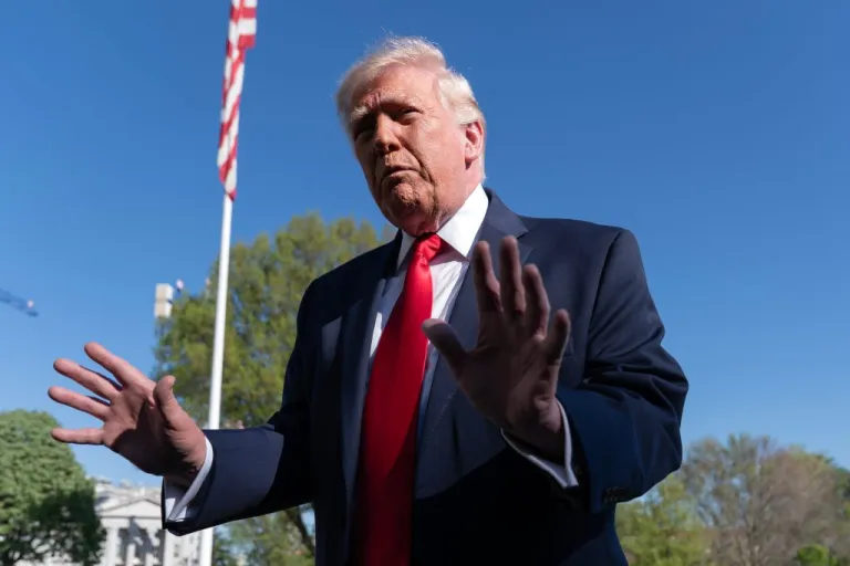 President Donald Trump talks to the media on the South Lawn.