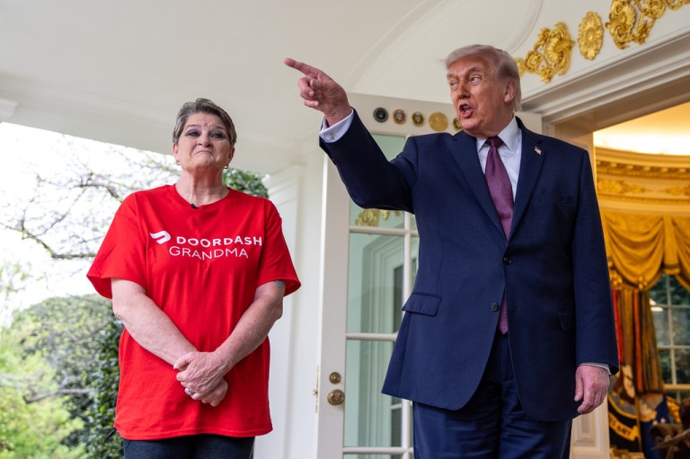 Sharon Simmons with DoorDash, listens as President Donald Trump speaks with reporters outside the Oval Office