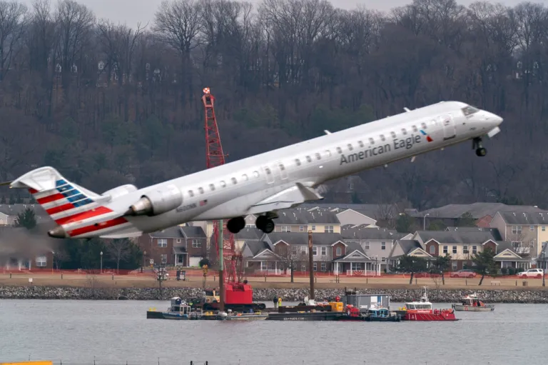 Salvage crews work on recovering wreckage near the site in the Potomac River of a mid-air collision between an American Airlines jet and a Black Hawk helicopter at Ronald Reagan Washington National Airport, Feb. 6, 2025, in Arlington, Va. (AP Photo/Jose Luis Magana, File)