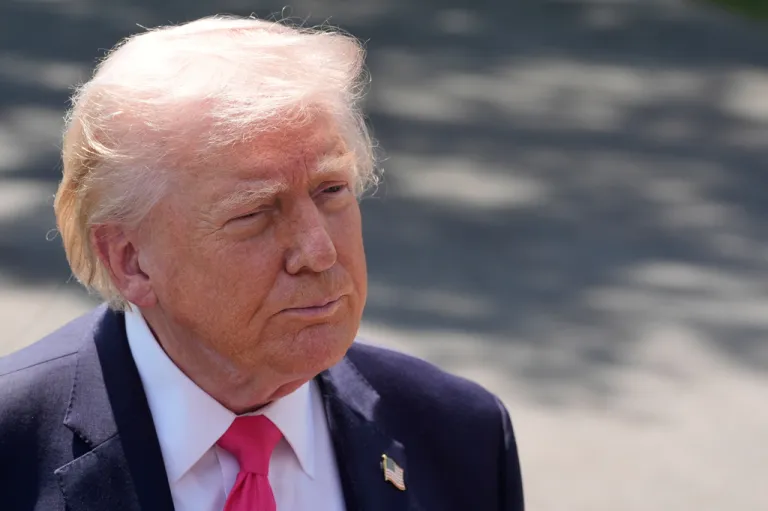 President Donald Trump speaks with reporters before departing on Marine One from the South Lawn of the White House in Washington.