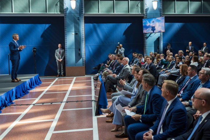 U.S. Department of Transportation Secretary Sean Duffy, left, speaks during a press briefing on flight safety, at the U.S. Department of Transportation, Tuesday, April 21, 2026, in Washington. (AP Photo/Tom Brenner)