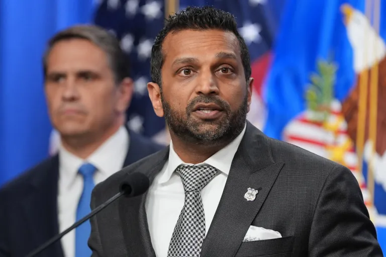Acting Attorney General Todd Blanche listens as FBI Director Kash Patel speaks