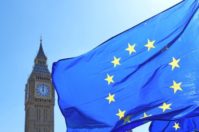 A flag held by a pro European Union campaigner in front of Big Ben in Westminster in London, Wednesday, April 22, 2026. (AP Photo/Kirsty Wigglesworth)