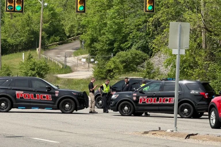 Police block a road near a chemical plant where a leak occurred