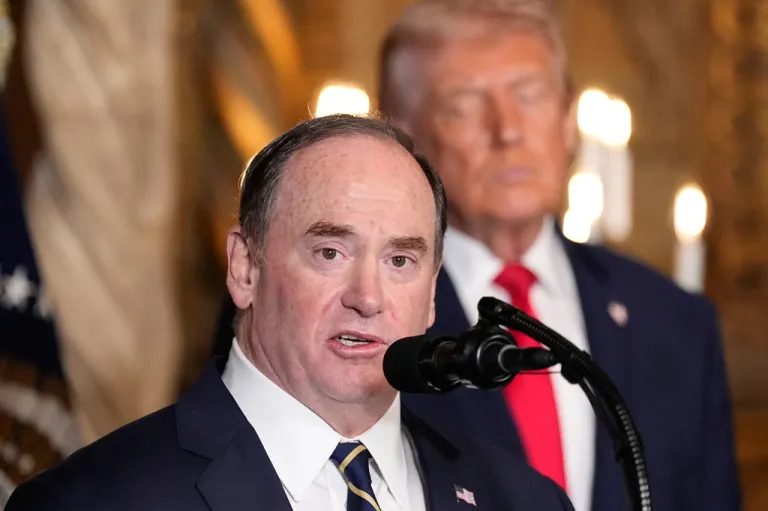 Secretary of the Navy John Phelan speaks, as President Donald Trump listens
