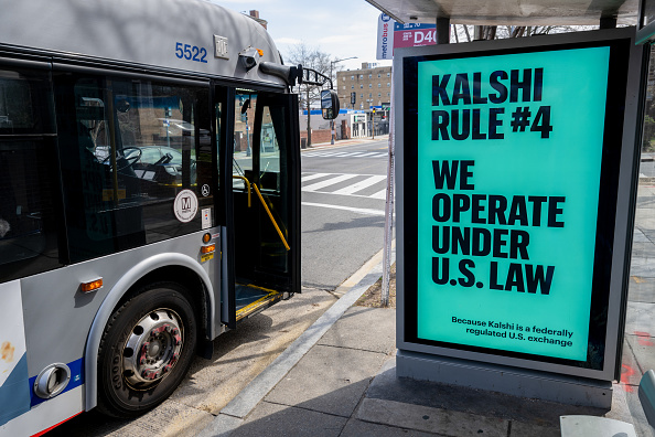 A Kalshi advertisement at a bus stop in Washington, D.C., on Thursday, March 19, 2026. The rapid expansion of prediction markets is facing increasingly aggressive pushback from state officials. (Photographer: Daniel Heuer/Bloomberg via Getty Images)
