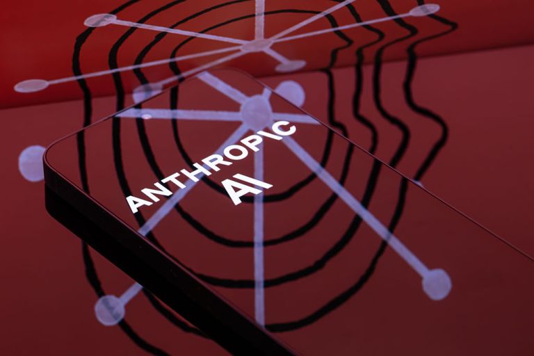 The Anthropic logo is displayed on a smartphone screen in this photo illustration in Brussels, Belgium, on March 31, 2026. A U.S. judge temporarily blocks the Pentagon from blacklisting the AI firm following a dispute over its refusal to allow its technology to be used for surveillance and autonomous weapons. (Photo by Jonathan Raa/NurPhoto via Getty Images)