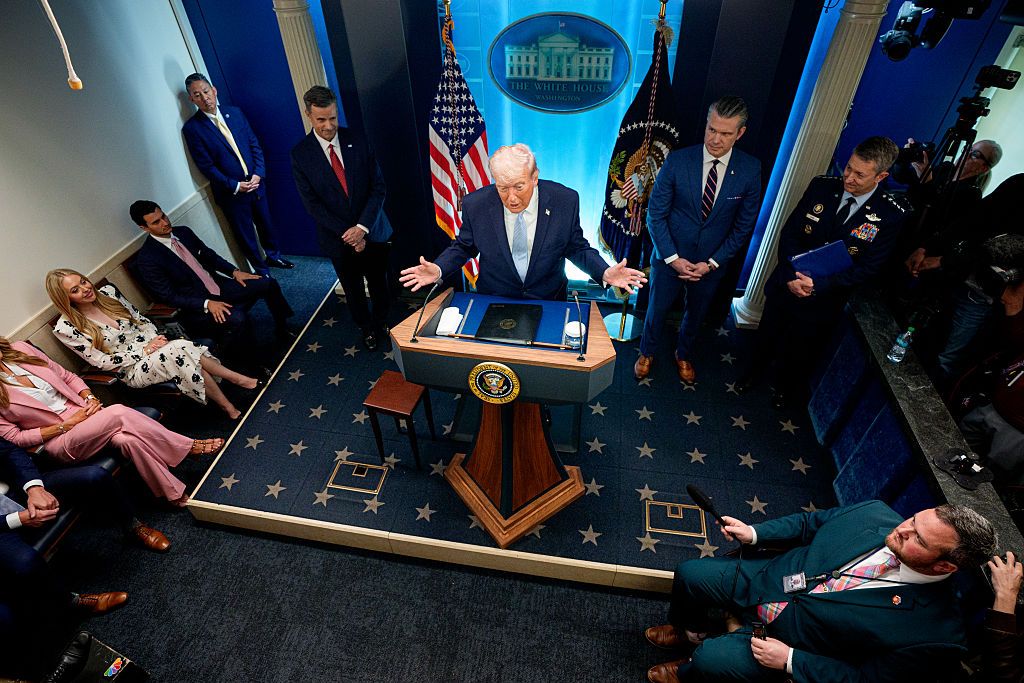 U.S. President Donald Trump, accompanied by CIA Director John Ratcliffe (C-L), Secretary of War Pete Hegseth (2nd-R) and Chairman of the Joint Chiefs of Staff General Dan Caine (R), speaks during a news conference in James S. Brady Press Briefing Room of the White House on April 06, 2026 in Washington, DC. President Trump spoke about the successful military mission to rescue a weapons systems officer whose F-15E Strike Eagle was shot down in Iran. (Photo by Andrew Harnik/Getty Images)