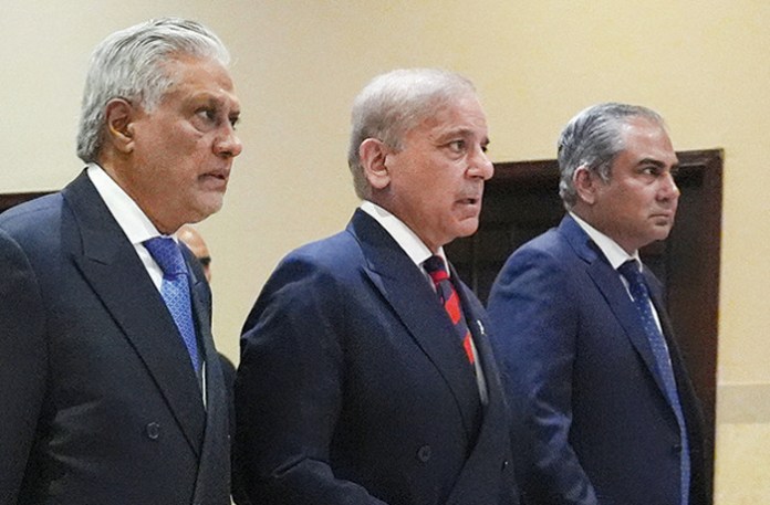 From left: Pakistani Deputy Prime Minister and Foreign Minister Mohammad Ishaq Dar, Pakistani Prime Minister Shehbaz Sharif, and Pakistani Interior Minister Mohsin Naqvi arrive for a meeting with Vice President JD Vance in Islamabad, Pakistan on April 11. (Jacquelyn Martin/AP)