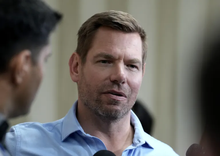 California gubernatorial candidate Rep. Eric Swalwell, D-Calif., talks with reporters after holding a town hall meeting.