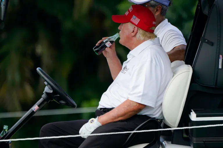 Donald Trump drinking Diet Coke at Trump National Doral Golf Club in 2022.