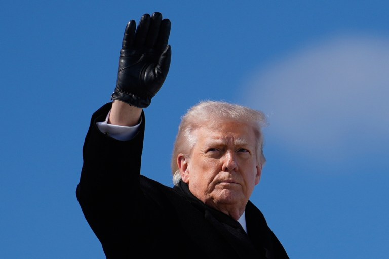 President Donald Trump waves as he boards Air Force One at Dover Air Force Base after attending the casualty return for the six crew members of an Air Force refueling aircraft who died when their plane crashed in western Iraq while supporting operations against Iran.